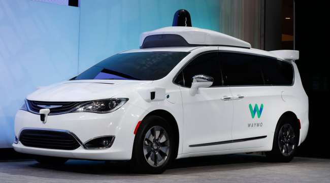 A Chrysler Pacifica hybrid outfitted with Waymo technology is displayed at an auto show in Detroit in January 2017.