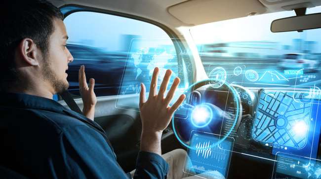 Driver in autonomous car with hands off wheel