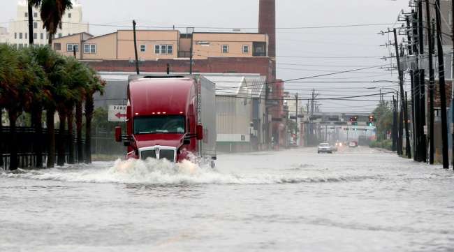 A truck drives through a flooded street in Galveston, Texas, on Sept. 21.