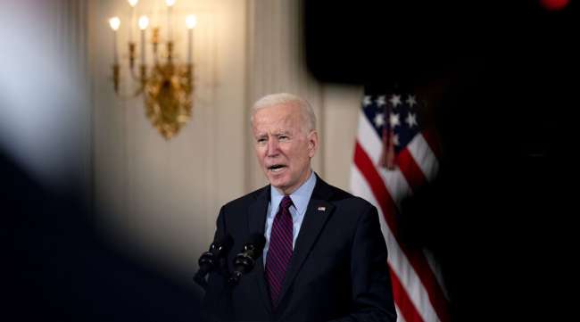 President Joe Biden speaks in the State Dining Room of the White House on Feb. 5. (Stefani Reynolds/Bloomberg News)