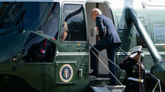 President Joe Biden boards Marine One on the Ellipse