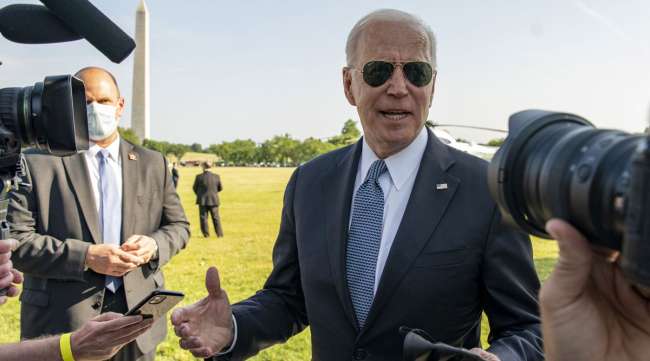 U.S. President Joe Biden speaks with media before boarding Marine One on May 25. (Tasos Katopodis/Bloomberg News)