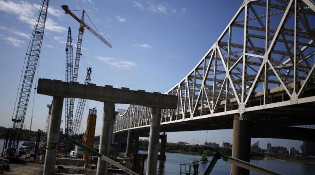 Construction crews work to erect a highway bridge in Kentucky in 2014. (Luke Sharrett/Bloomberg News)