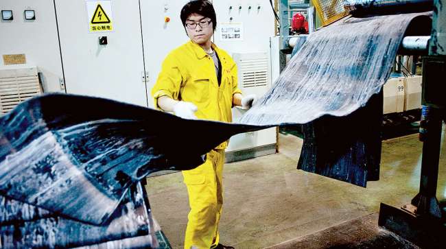 Worker in Chinese tire factory