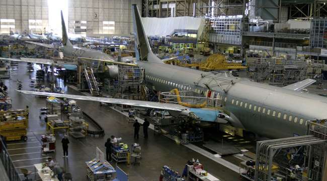 Workers assemble Boeing 737 airplanes.
