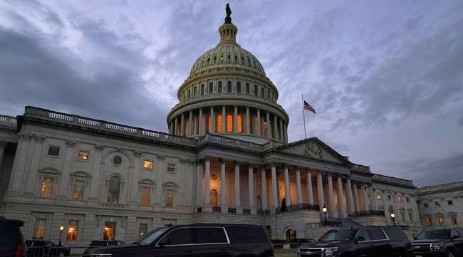 The U.S. Capitol building at dusk on Dec. 21. (Jacquelyn Martin/Associated Press)