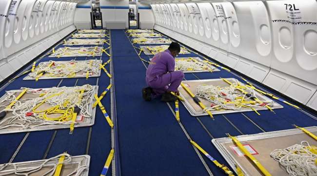 Airlines are removing seats from passenger planes to make way for cargo shipments.