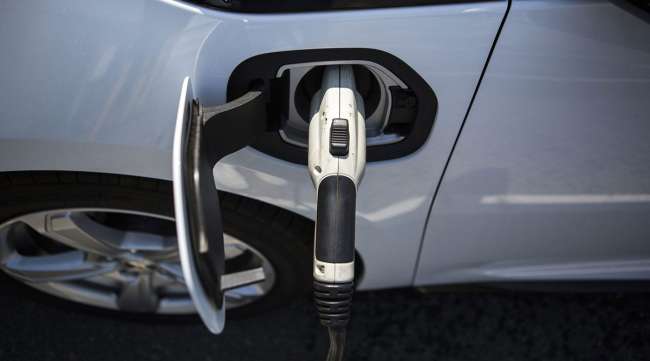 A charging plug is connected to an electric vehicle.