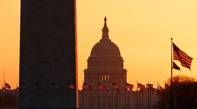The Washington Monument and the U.S. Capitol are seen in Washington at sunrise on March 18.