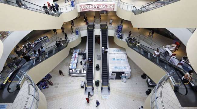 Shoppers walk through the Queens Center shopping mall in New York in September 2020.