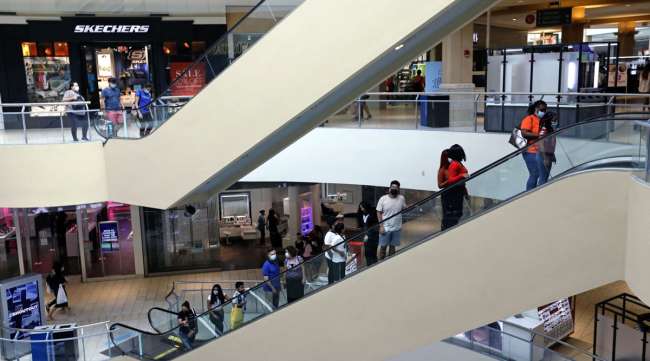Shoppers are seen at the Queens Center shopping mall on Sept. 9.