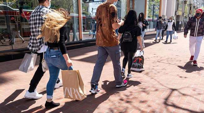 Shoppers carry bags on Market Street in San Francisco