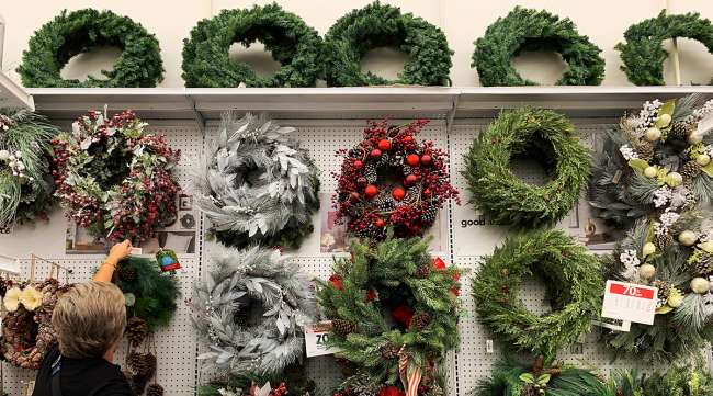 Shopper looking at wreaths