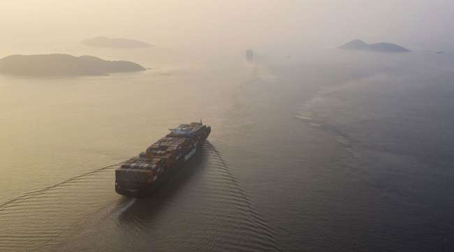 A containership sails out of the Yangshan Deepwater Port. (Qilai Shen/Bloomberg News)