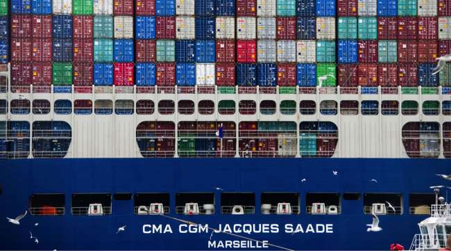 Shipping containers sit aboard the CMA CGM SA Jacques Saade LNG container ship. (Nathan Lane/Bloomberg News)