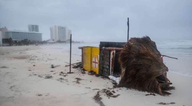 A lifeguard tower lies on its side in Cancun, Mexico, on Oct. 7, after being toppled by Hurricane Delta.