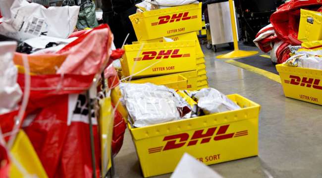 An employee sorts packages at a DHL Worldwide Express facility in Chicago. (Daniel Acker/Bloomberg News)