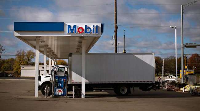 Truck fills up at Mobil gas station