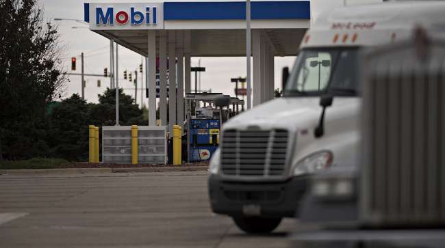 Trucks sit in a parking lot outside a Mobil gas station in Morton, Ill.
