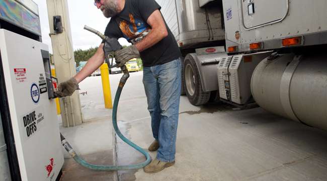 Man gets ready to add diesel to truck