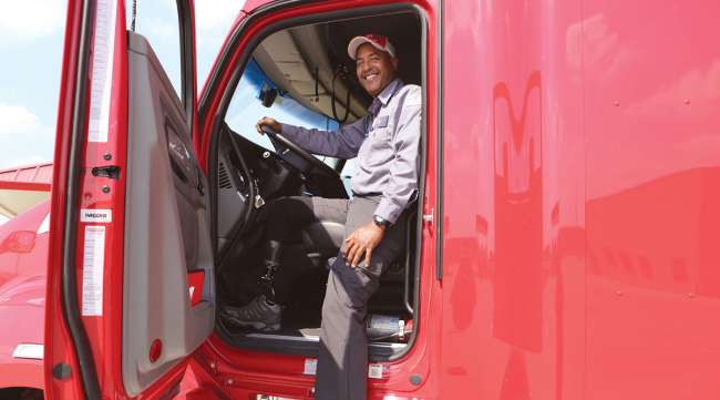 Groendyke Transport driver Antonio Cruz steps into his truck cab. (Groendyke Transport)