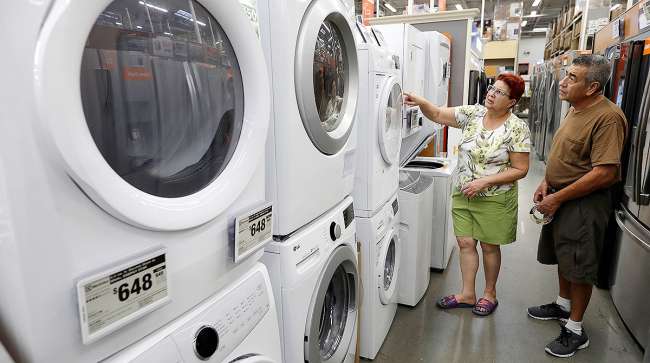 shoppers look at washer-dryers