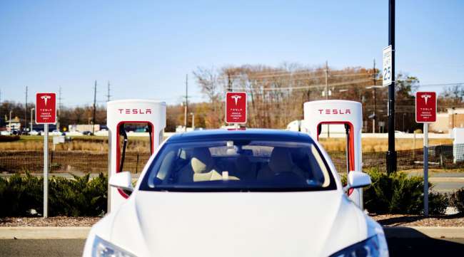 A Tesla vehicle sits parked in front of a charging station in New Jersey in November 2019.