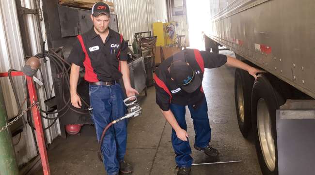 CFI technicians inspect a truck's tires