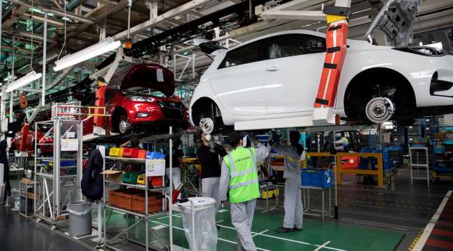 Renault SA employee s work on the Zoe electric vehicle assembly line at the company's factory in Flins, France, in May.