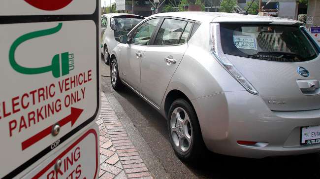 A Nissan Leaf charges in Portland, Ore.