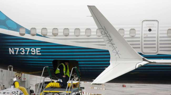 An employee works on a Boeing 737 Max 9 plane at the company's facility in Renton, Wash.
