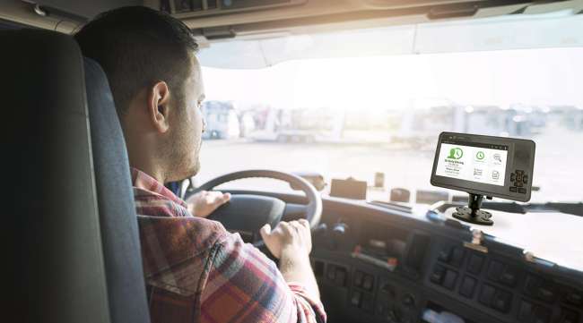 Driver looking at screen in truck