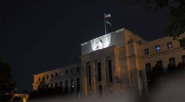 Federal Reserve building in Washington, D.C., at night