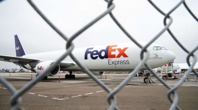 A FedEx Boeing 767-300F cargo plane sits at the San Diego International Airport on April 27.