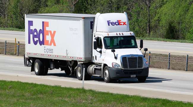 A FedEx Express truck on a highway in Kentucky