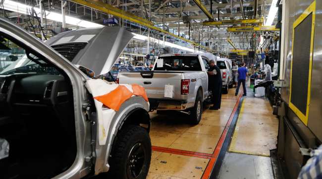 A United Auto Workers assemblyman works on a 2018 Ford F-150 truck in Michigan.