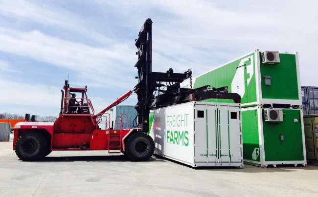 Forklift picks up container at Freight Farms production facility