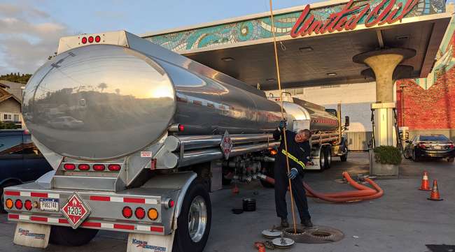 Trucker filling up with gasoline