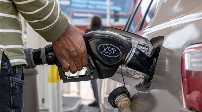 Customer pumps gas into car