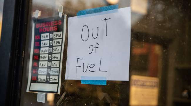 A sign reading "Out of Fuel" at an Exxon station in Lynchburg, Va.