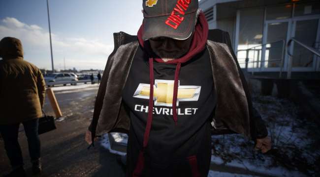 A retired workers wears a Chevrolet sweatshirt outside the GM Oshawa assembly plant in December 2019.