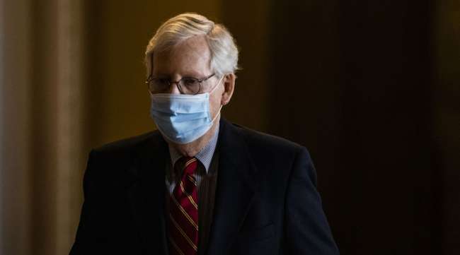 Senate Minority Leader Mitch McConnell leaves his Capitol Hill office in Washington on March 15. (Samuel Corum/Bloomberg News)