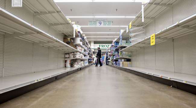 Empty paper goods aisles are seen at a supermarket in Princeton, Ill., on April 16.