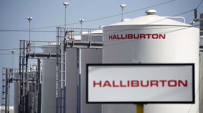 Halliburton signage is displayed alongside storage tanks in Port Fourchon, La.