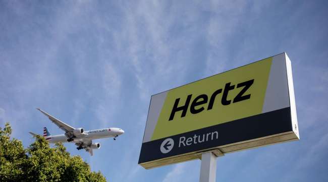 Signage is displayed outside of a Hertz rental location at Los Angeles International Airport (LAX) in Los Angeles in August 2019.