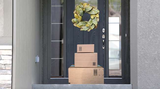 packages at door with wreath