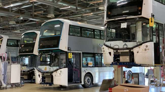 Wrightbus hydrogen double-decker buses are seen on the production line.