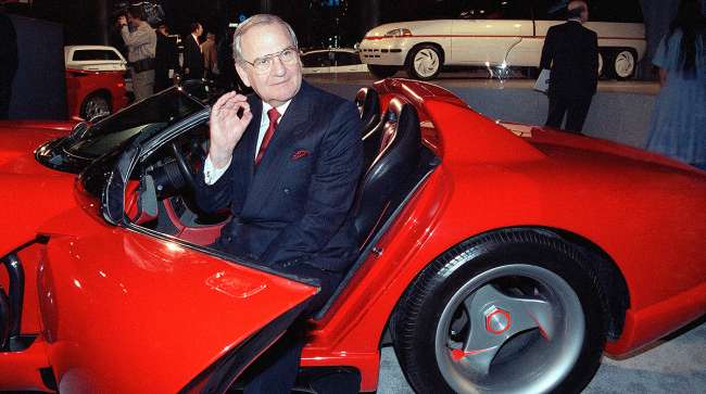 Late Chrysler Corporation Chairman Lee Iacocca sits in a 1990 Dodge Viper sports car
