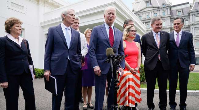 President Joe Biden, with a bipartisan group of senators, speaks June 24 outside the White House. (Jacquelyn Martin/Associated Press)