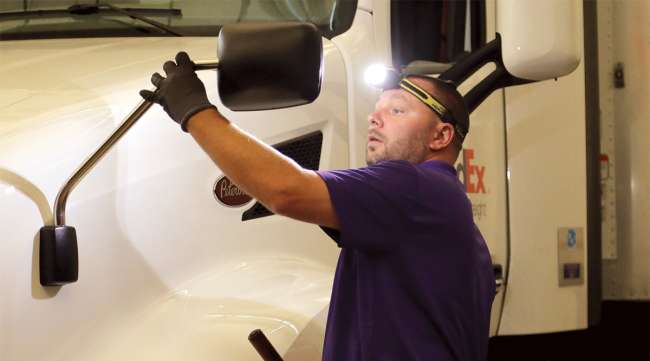 Dan Knight of FedEx Freight inspects his truck